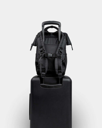 Portland Gear Cascade Compact Backpack on luggage in Black