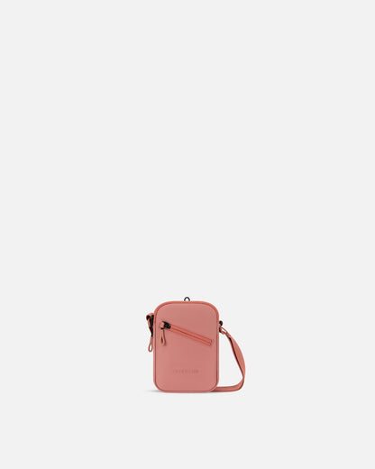 Pink crossbody bag on a white background