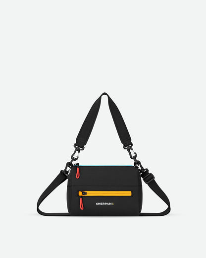 Black crossbody bag with a yellow zipper on a light gray background