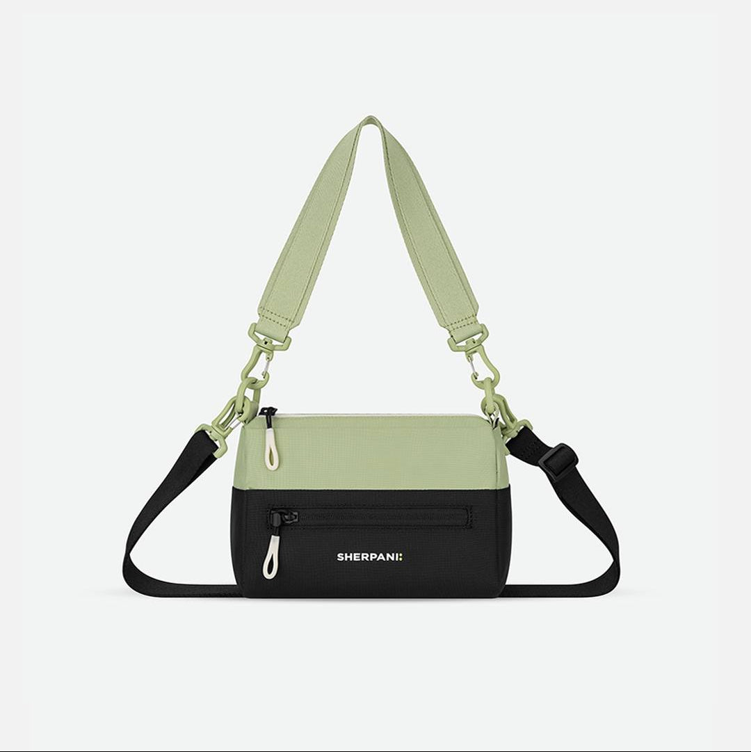 Green and black bag with a strap on a white background