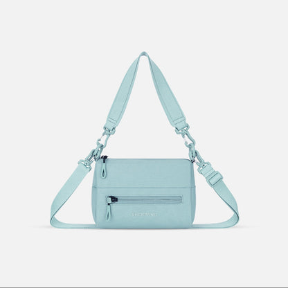 Light blue handbag with a strap on a white background
