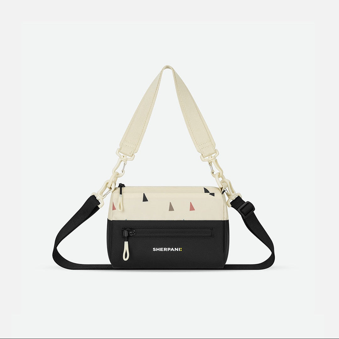 Multicolored bag with a strap on a white background