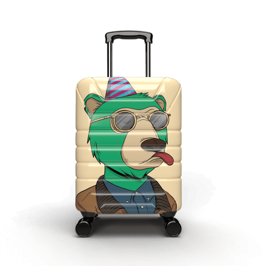 Green cartoon bear with a displeased look on a tan colored hardcase carry on suitcase